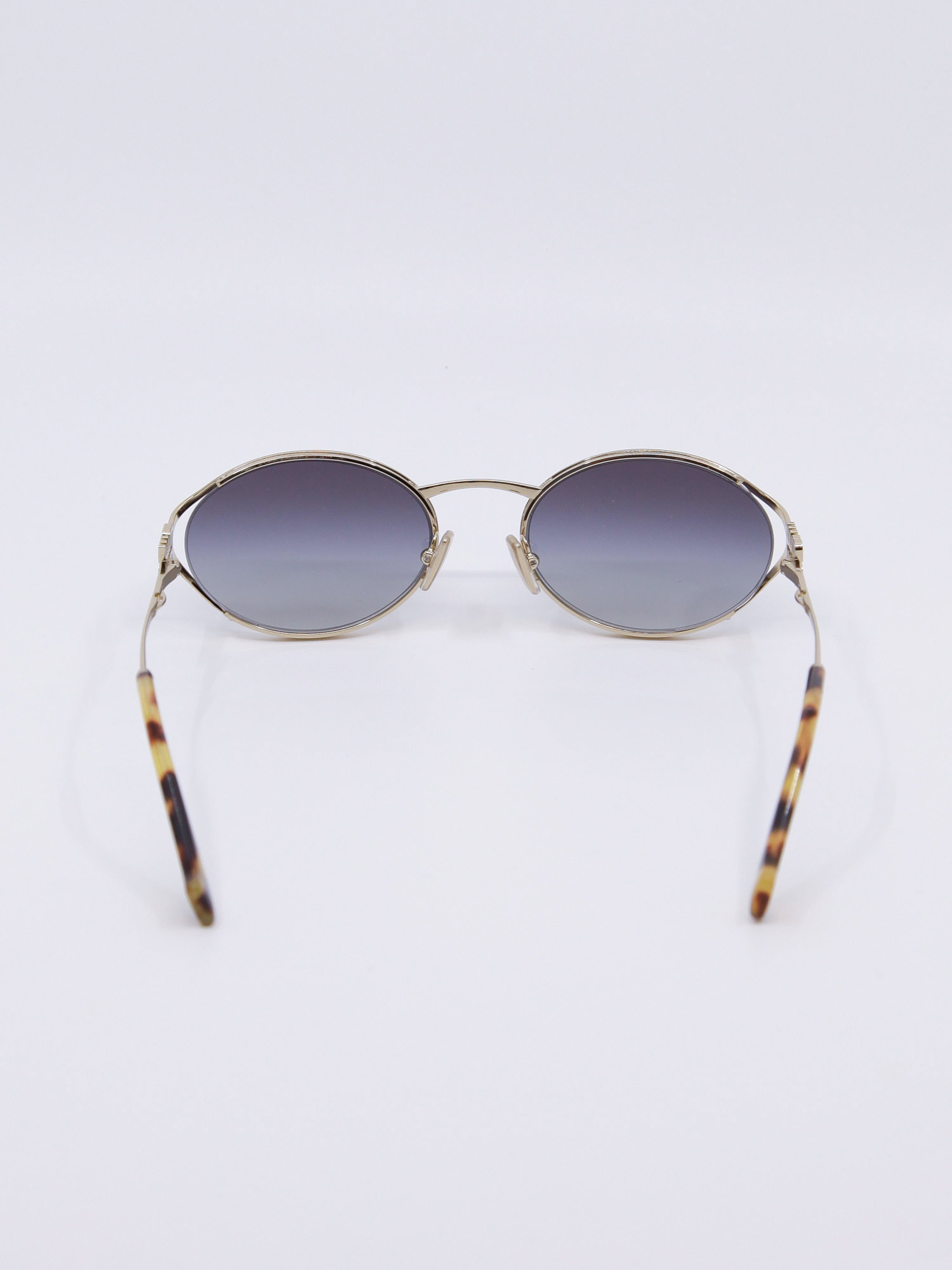 Metallsolbrille i gull med graderte blå solbrilleglass