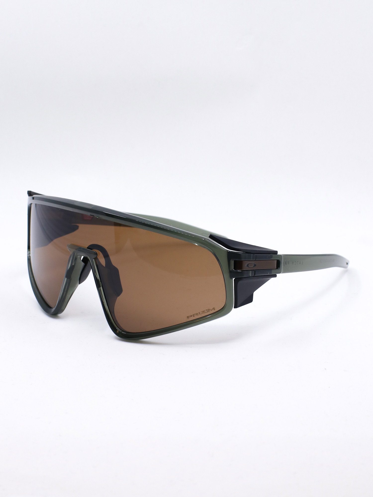 Sportsbrille med grønn ramme og brune glass