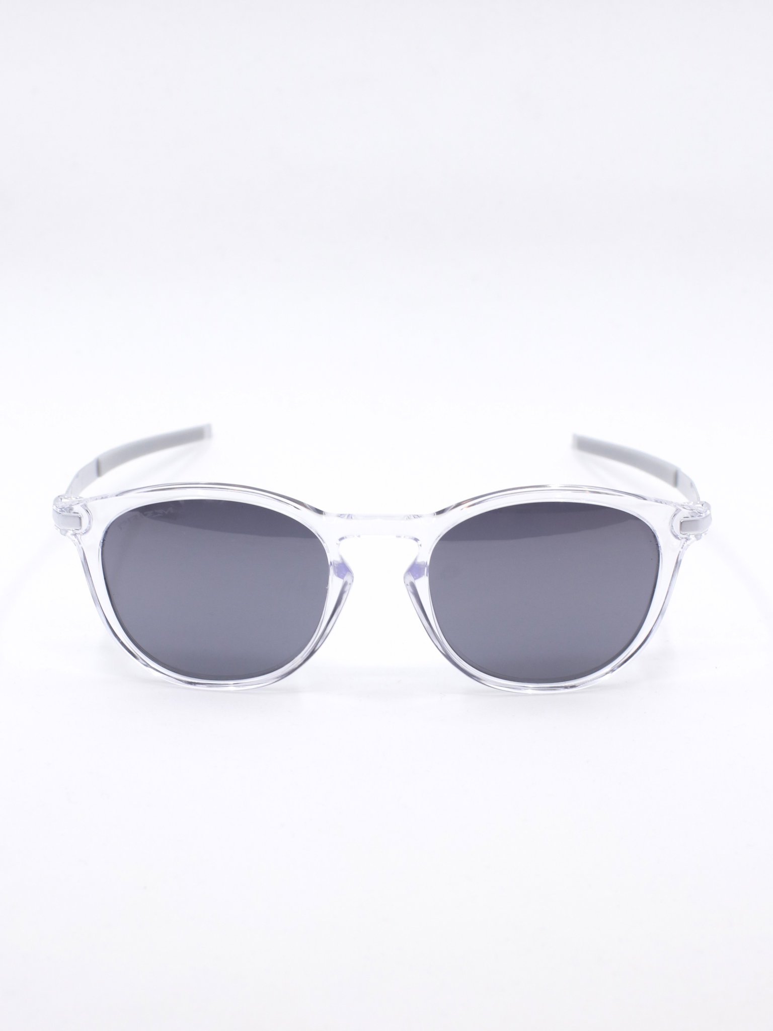 Rund solbrille med transparent ramme og grå glass