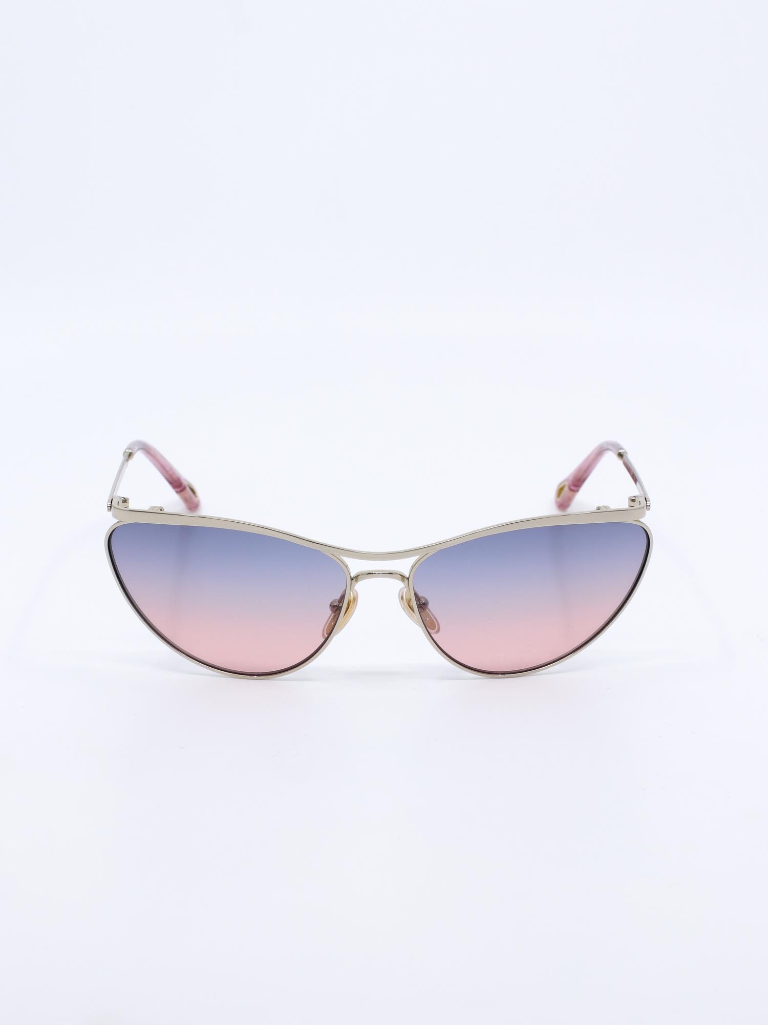 Metallsolbrille i gull med cateye fasong og rosa graderte glass