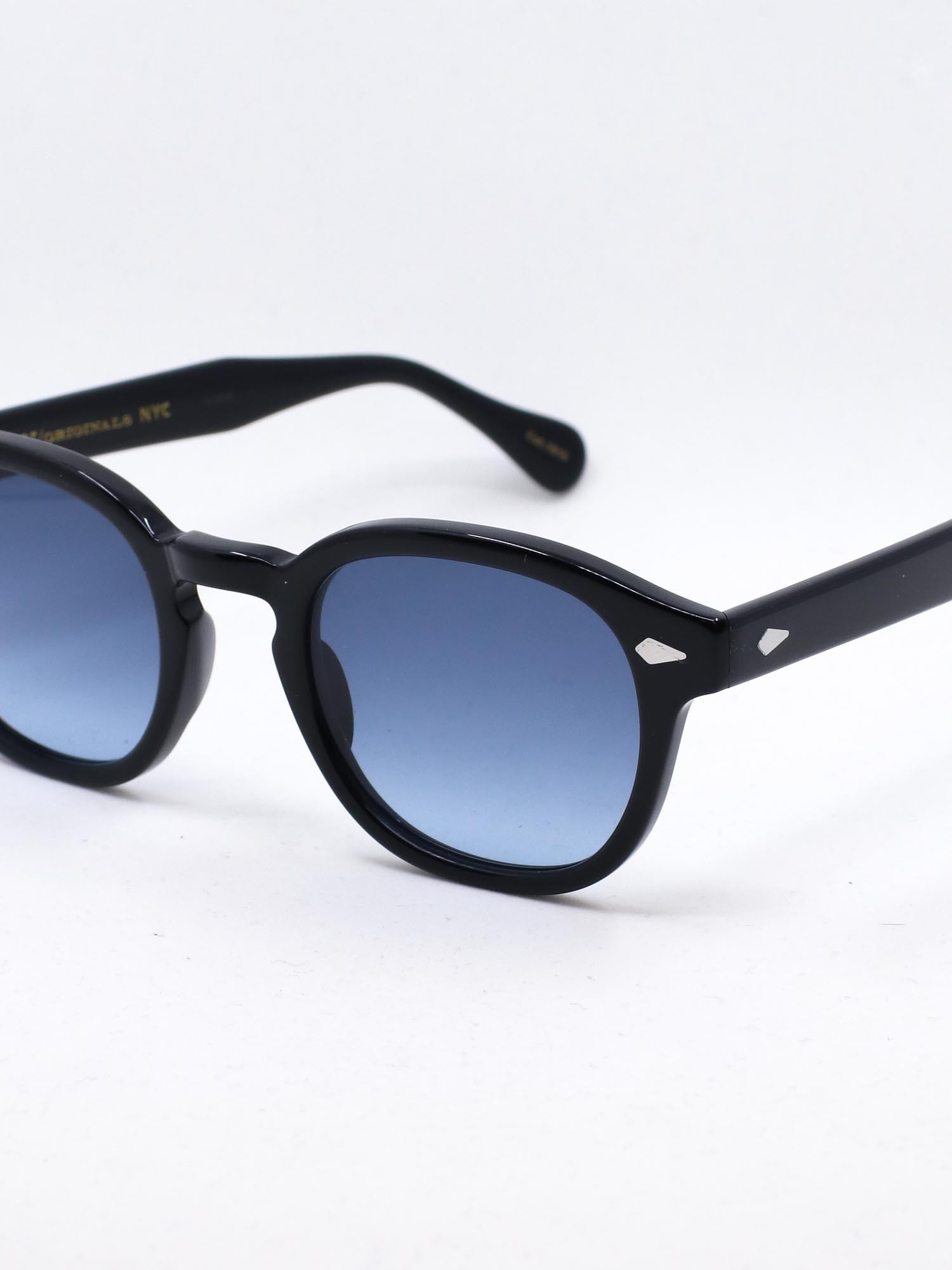 Svart solbrille med blå glass
