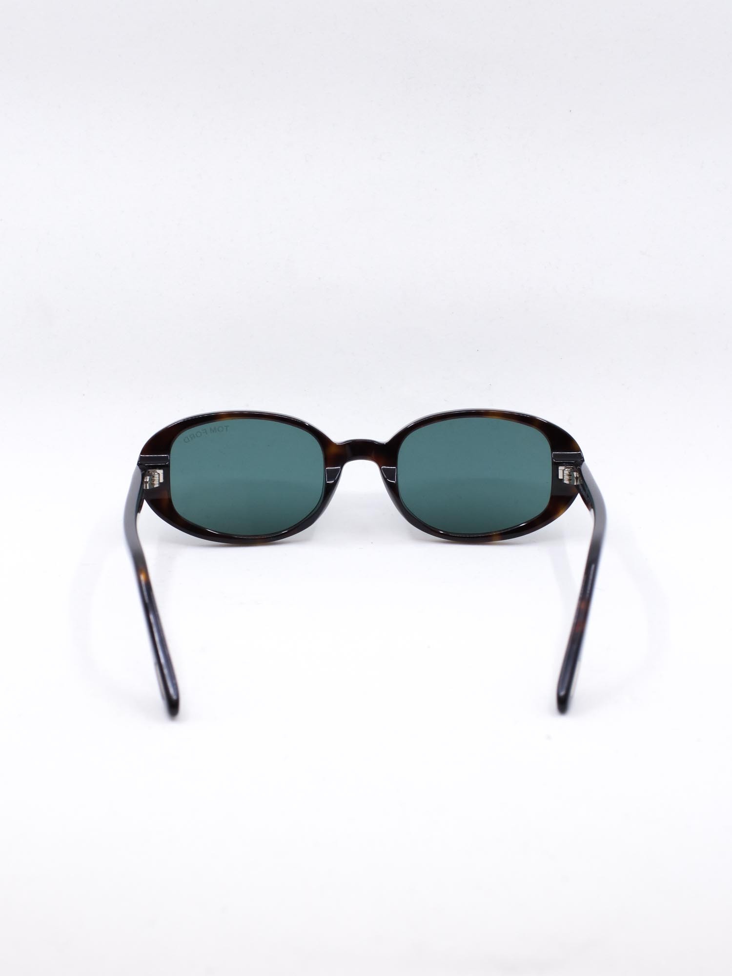 Oval solbrille med brun ramme og blå glass