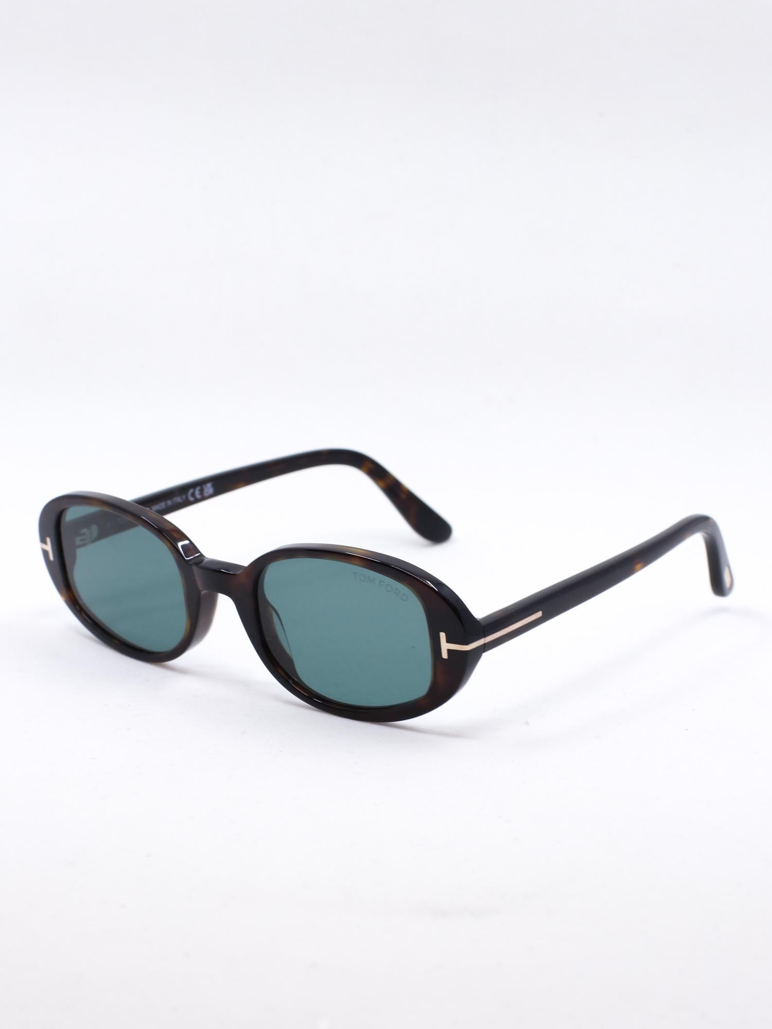 Oval solbrille med brun ramme og blå glass