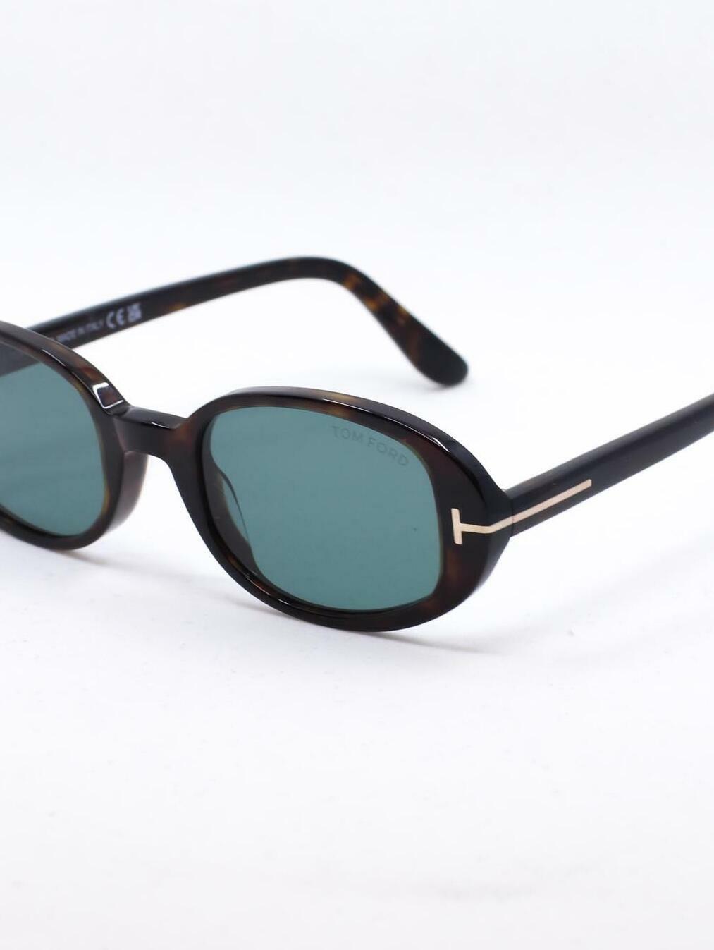 Oval solbrille med brun ramme og blå glass