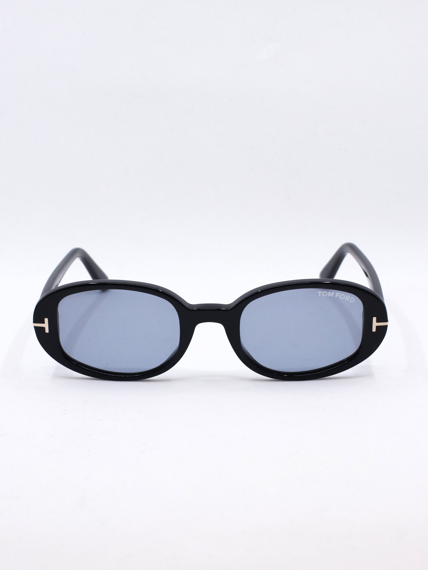 Oval solbrille med svart ramme og blå glass