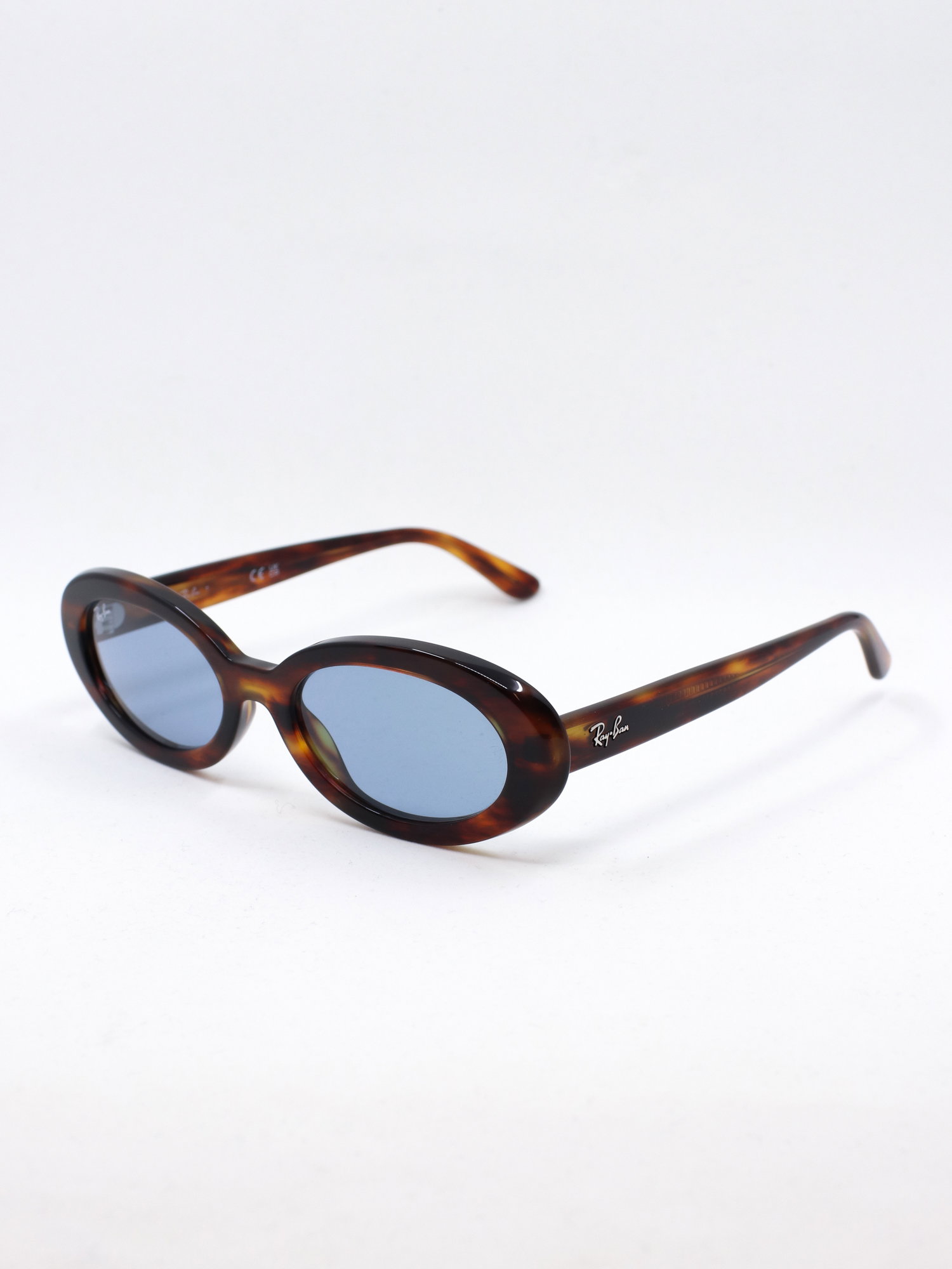 Oval solbrille med brun ramme og blå solbrilleglass