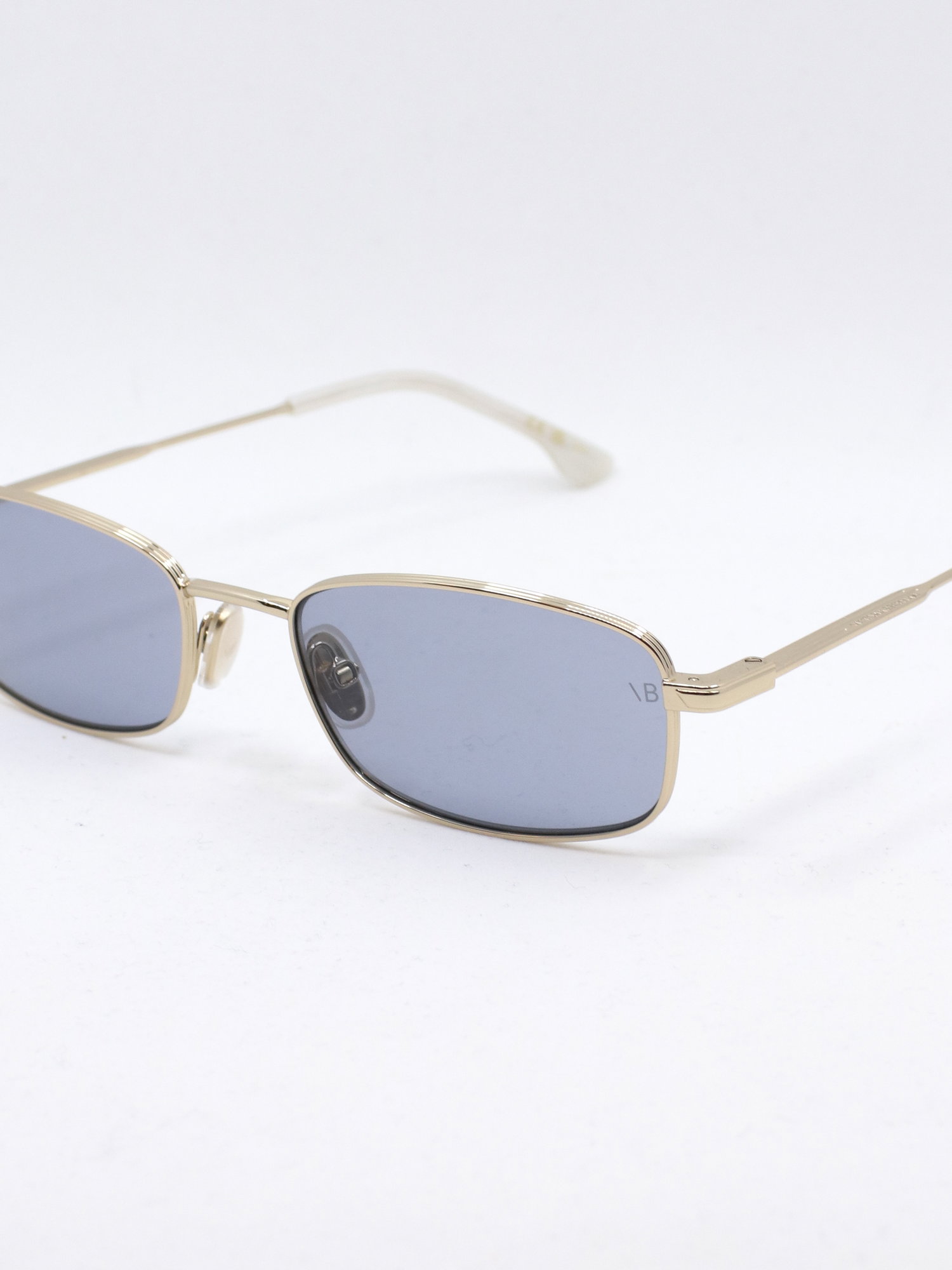 Smal metallsolbrille med blå glass