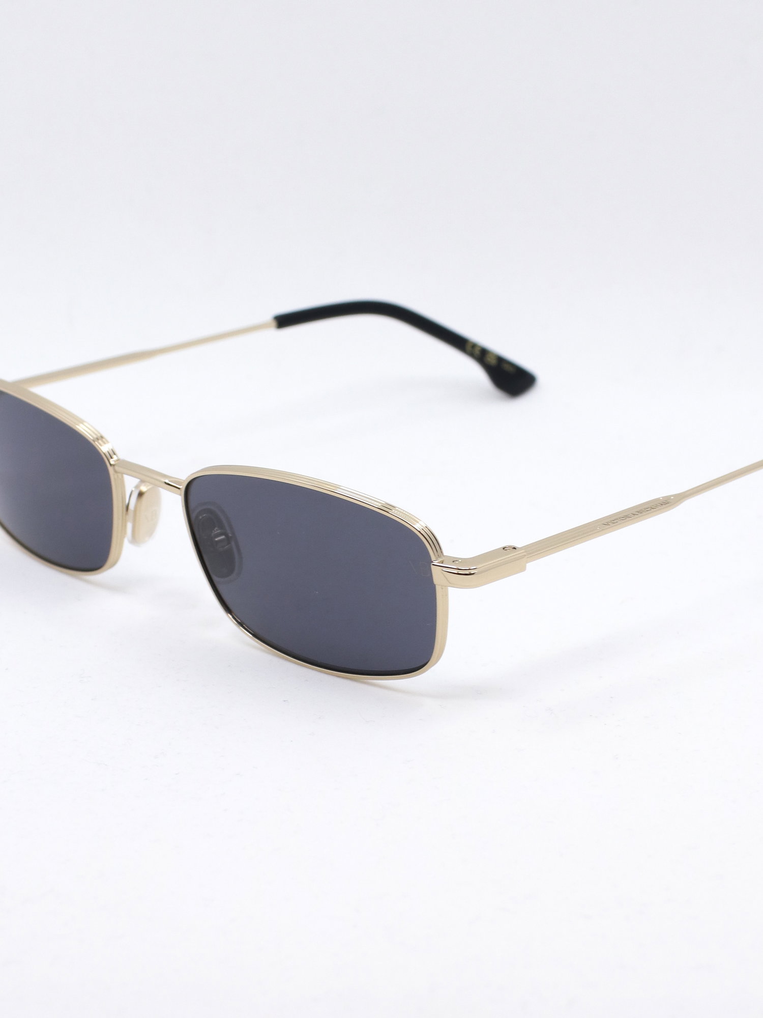 Smal metallsolbrille i gull