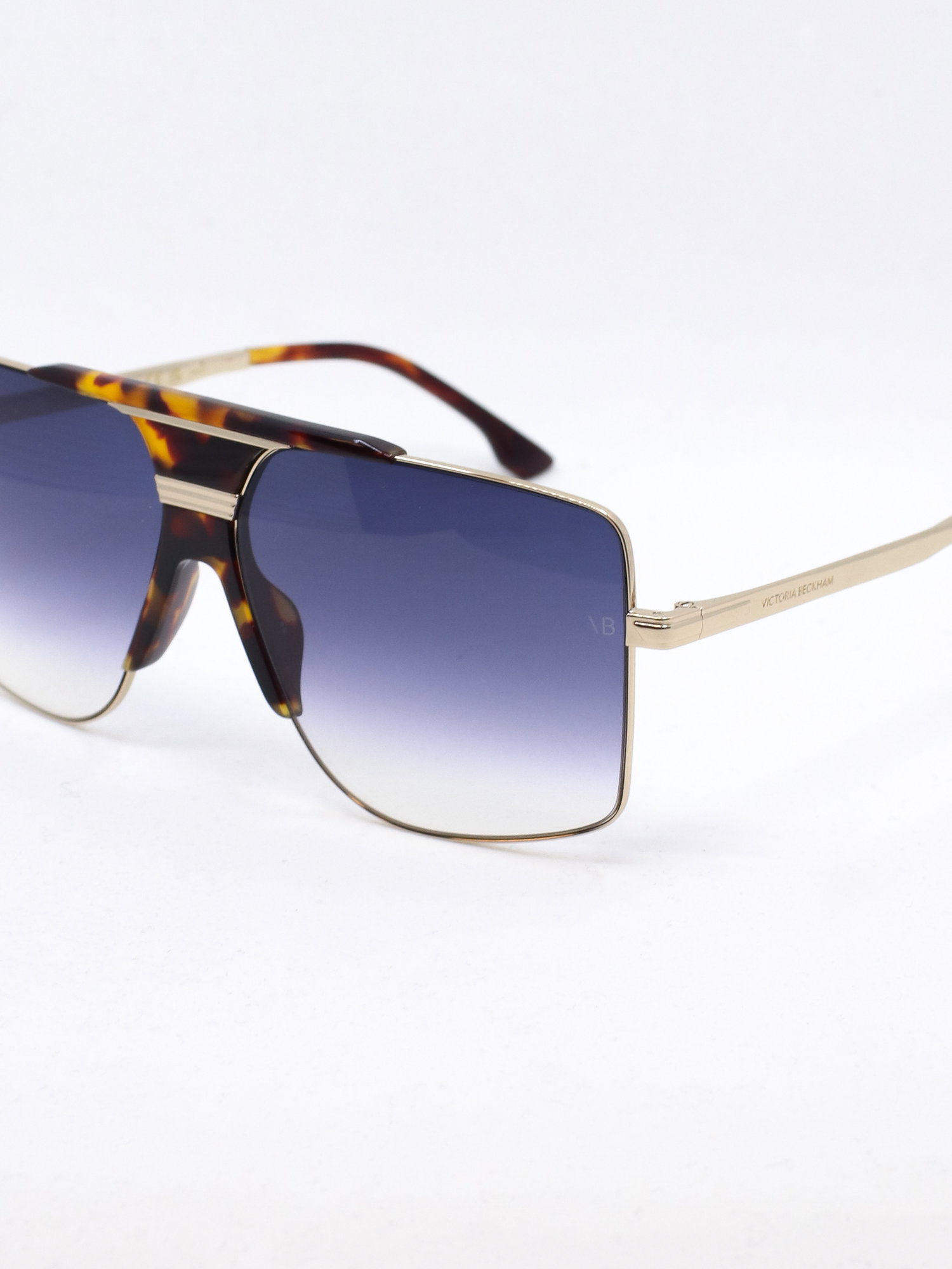 Bred pilotsolbrille i metall med blå graderte solbrilleglass