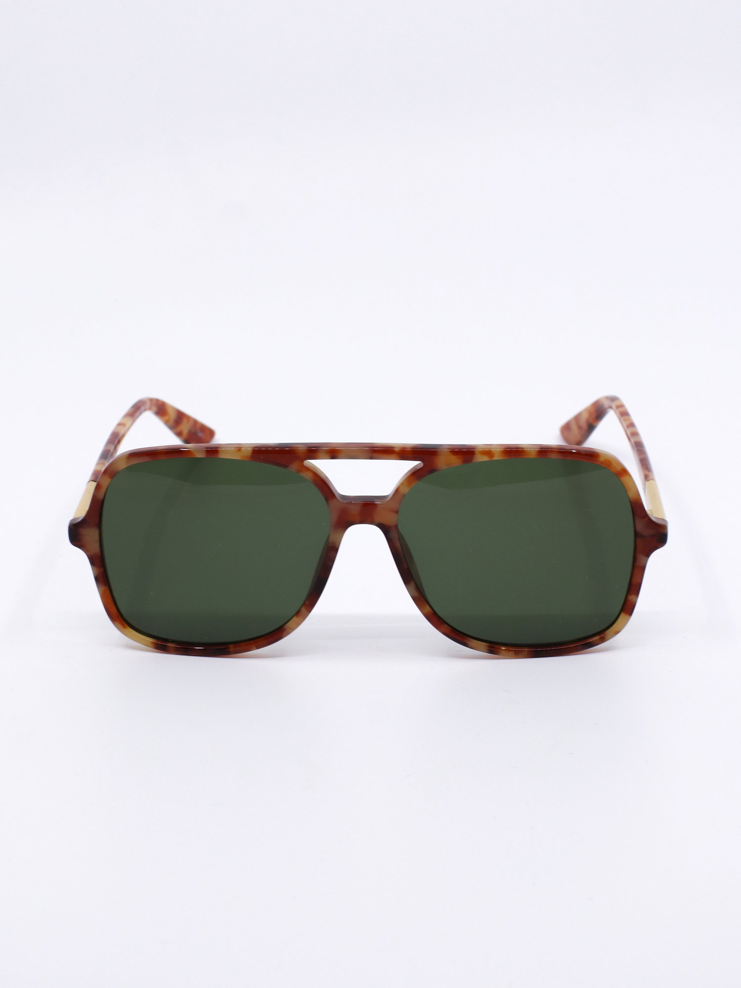 Pilotsolbrille med brunt, mønstret farge og grønne glass