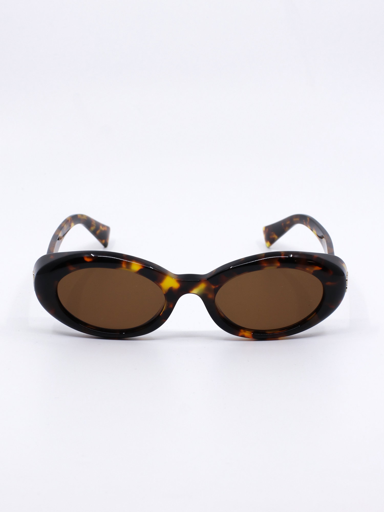 Oval solbrille med brunt mønster og brune solbrilleglass