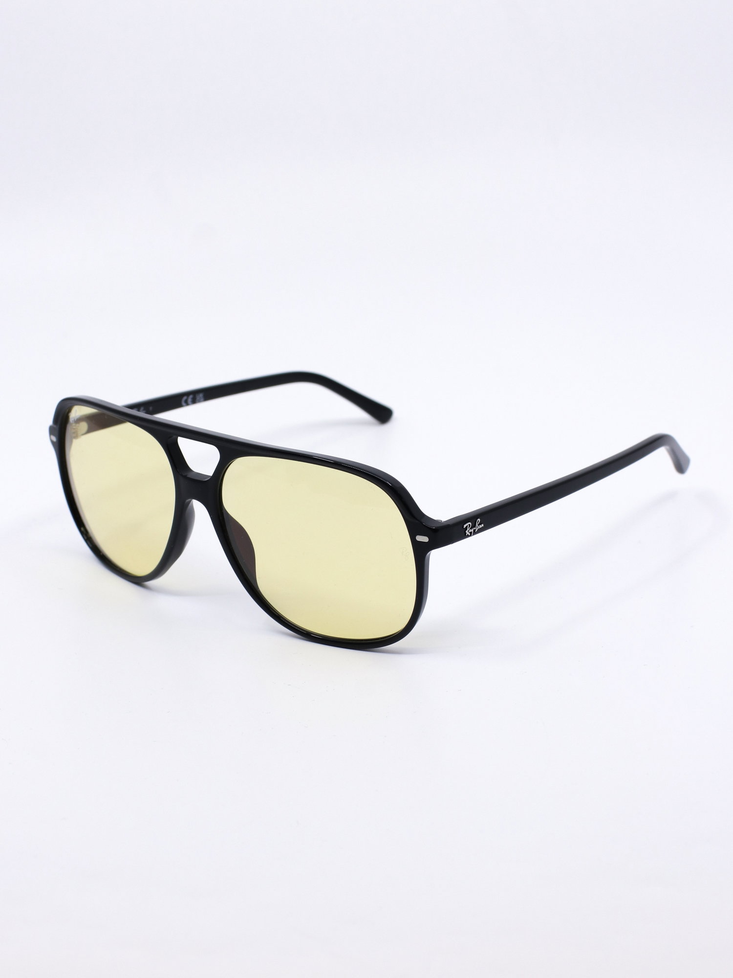 Pilotsolbrille med svart ramme og gule glass