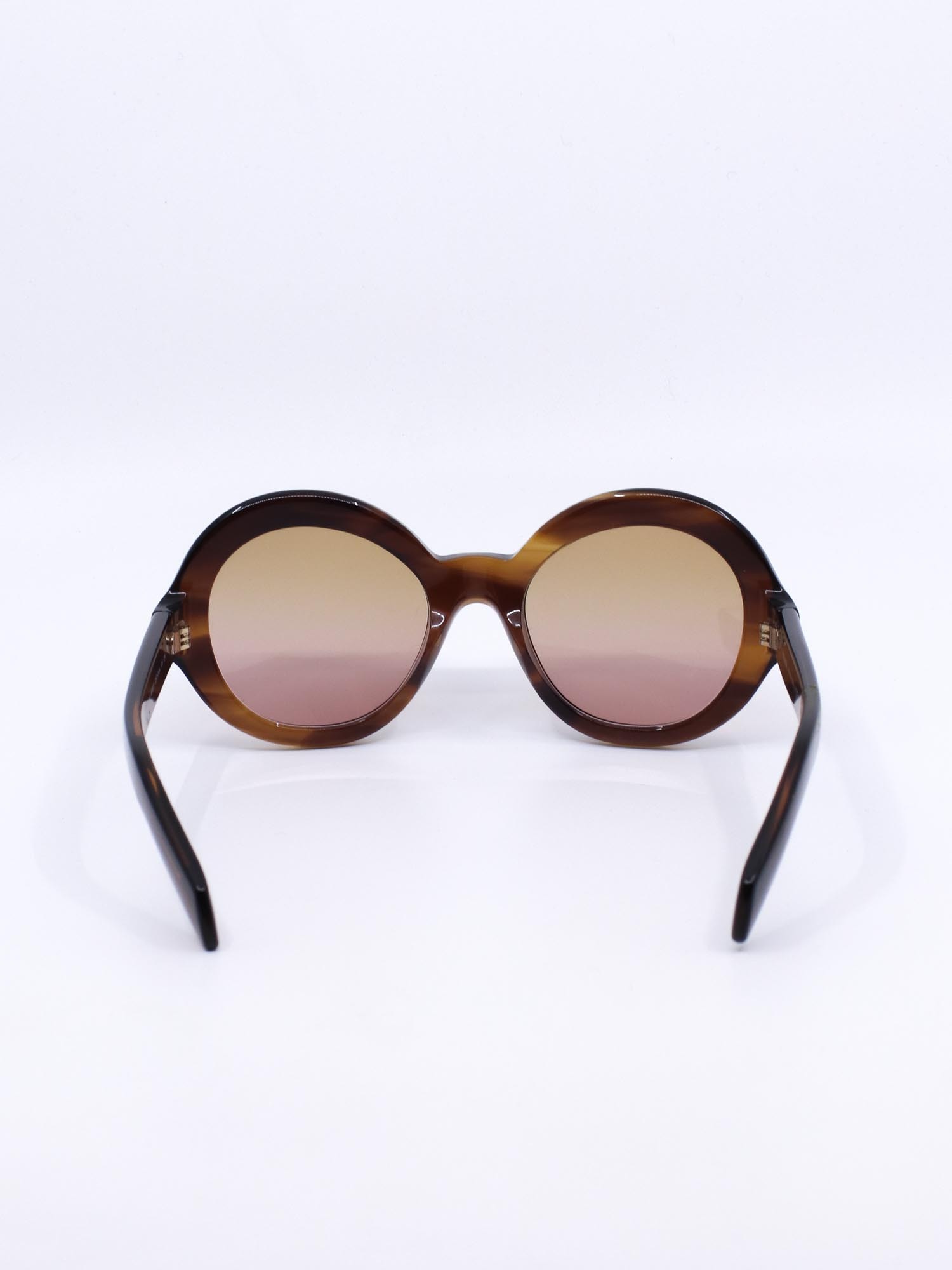 Solbrille med oversized rund fasong og brun farge med hint av rosa