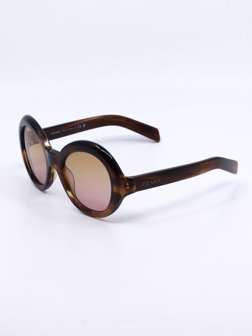 Solbrille med oversized rund fasong og brun farge med hint av rosa