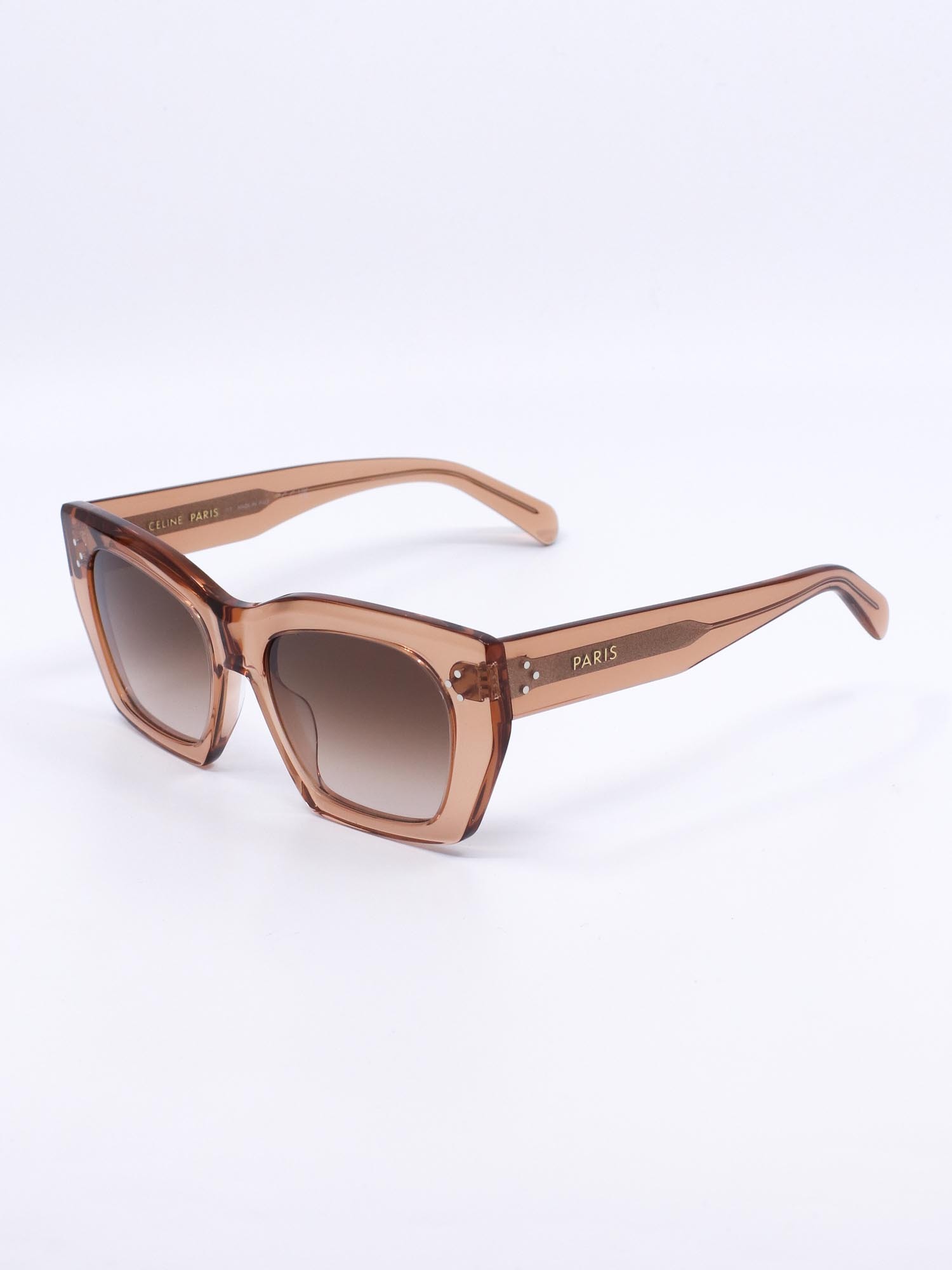 Solbrille med cateye fasong, transparent oransje farge og gradete glass