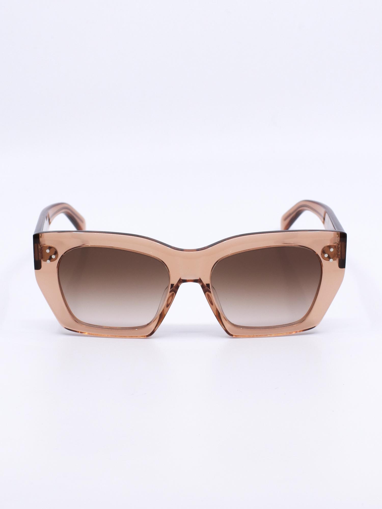 Solbrille med cateye fasong, transparent oransje farge og gradete glass
