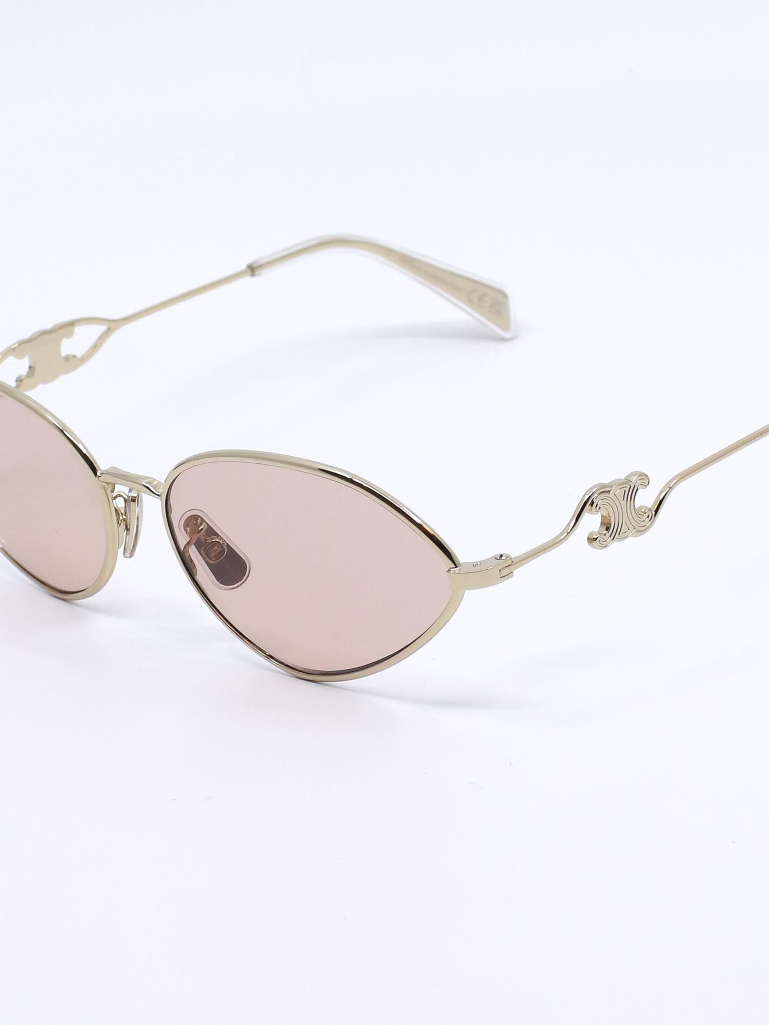 Metallsolbrille i gull med rosa glass og cateye fasong