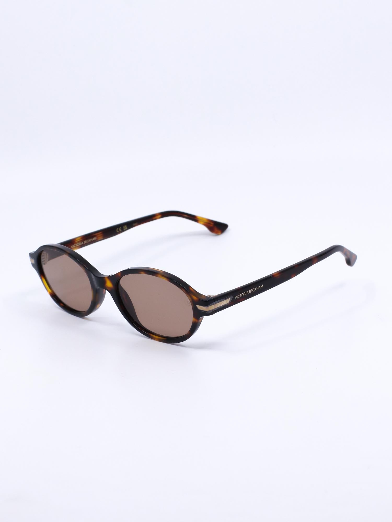 Oval solbrille med brun ramme og brune glass