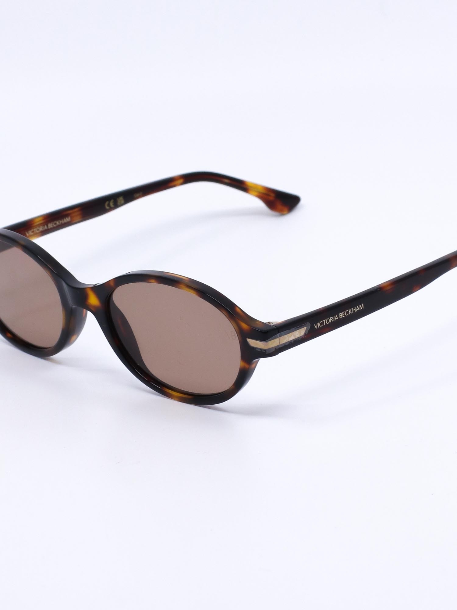 Oval solbrille med brun ramme og brune glass
