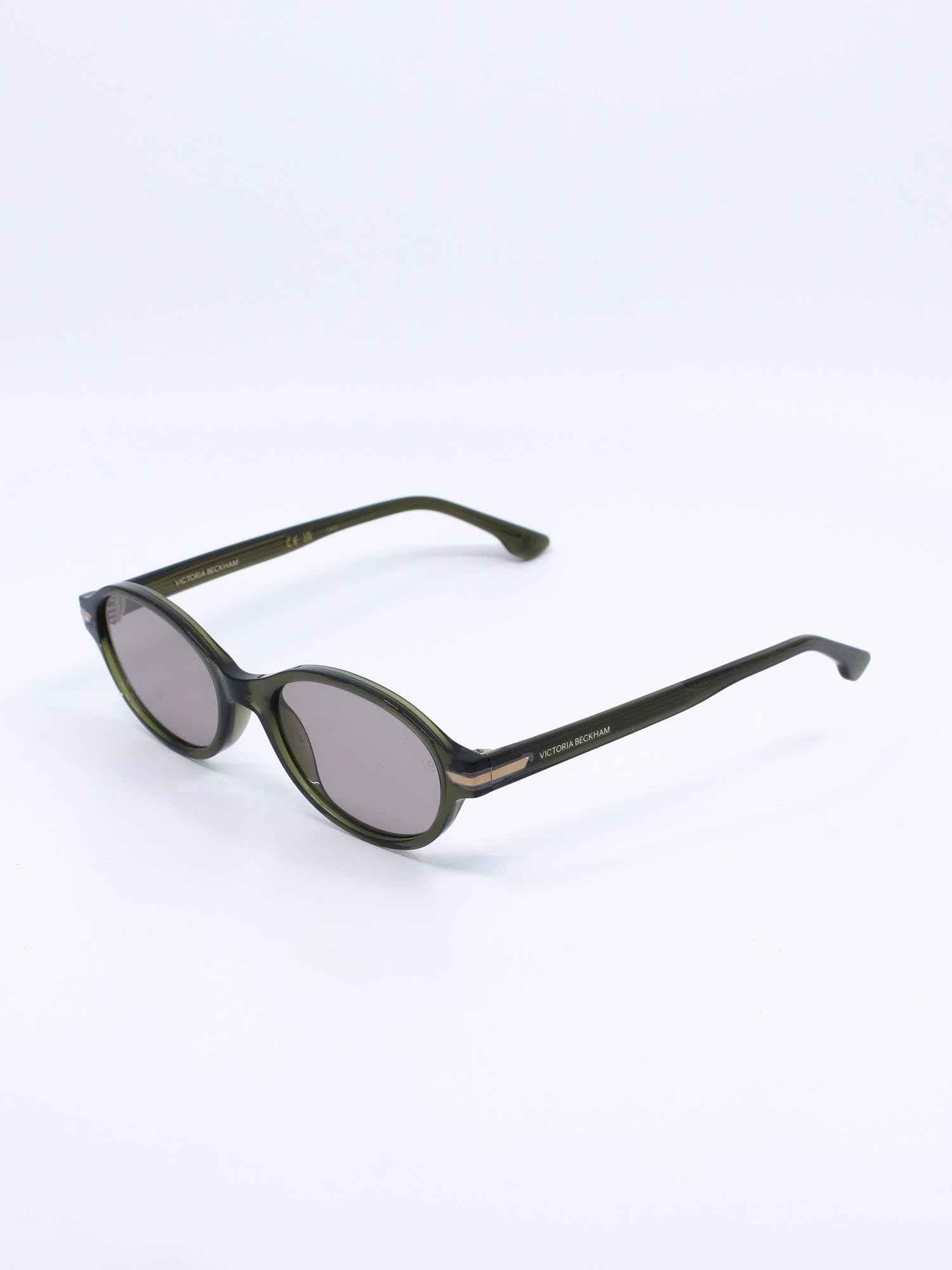 Oval solbrille med grønn ramme og lyse glass