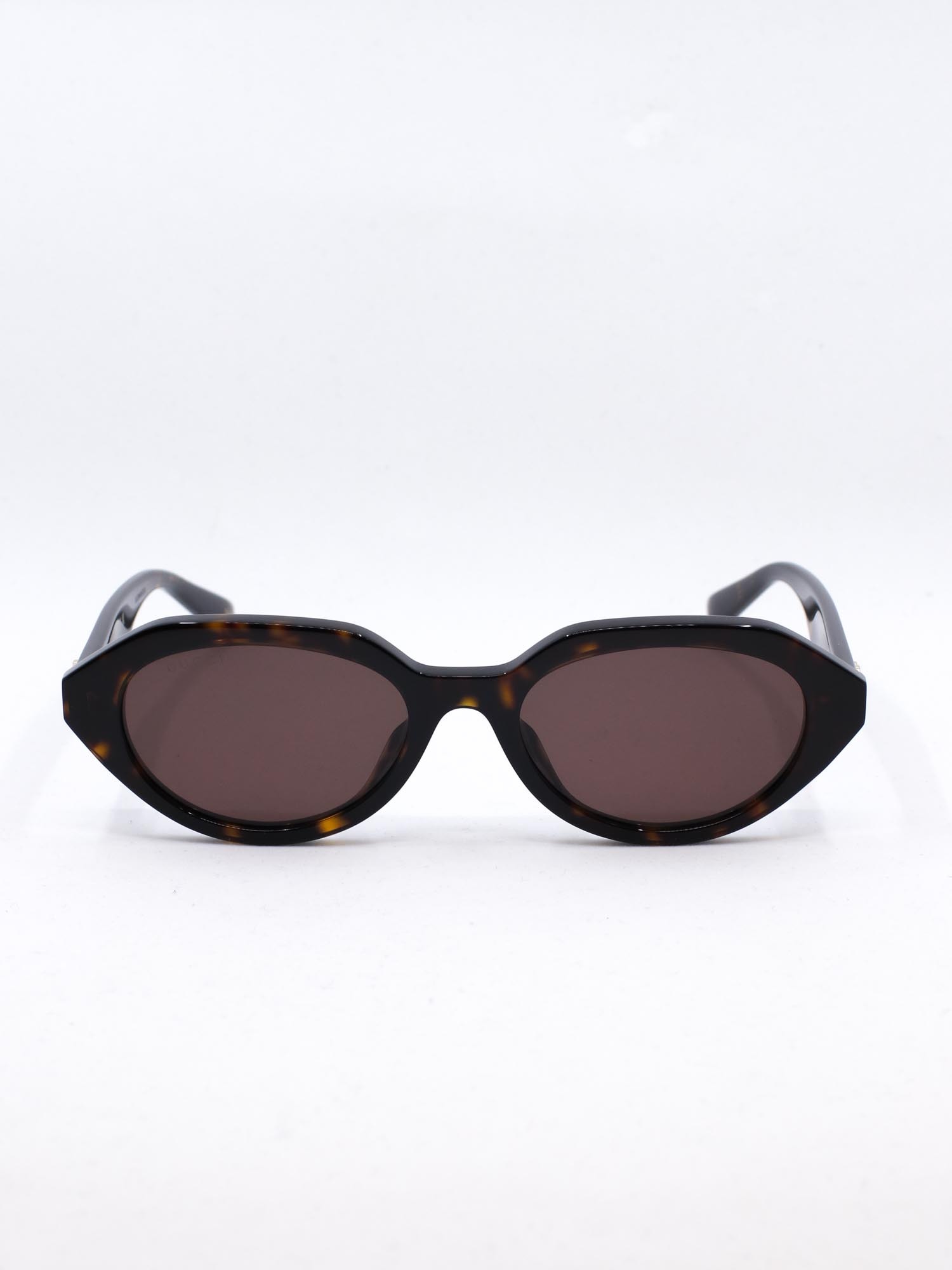 Oval og smal solbrille i brun