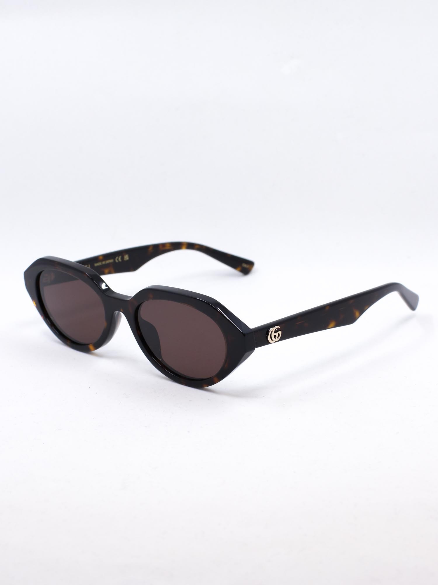 Oval og smal solbrille i brun